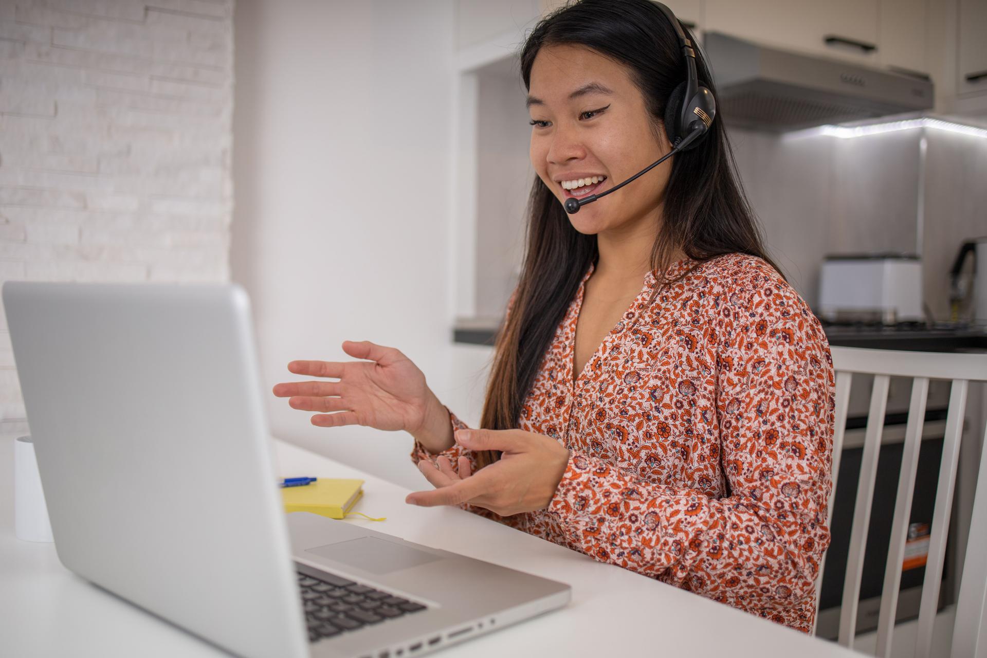 Young fashionable woman working at home