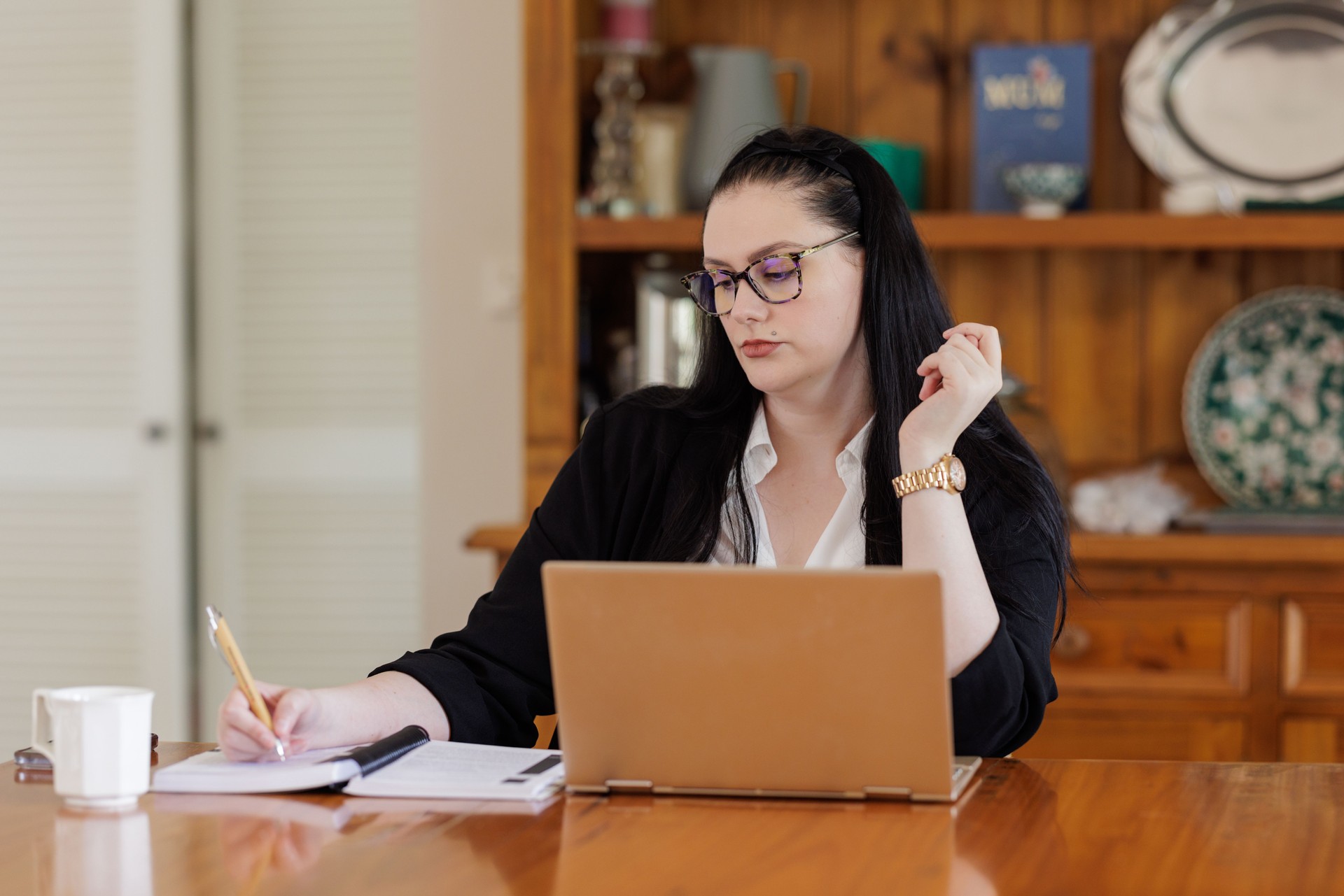 Businesswoman working at home on her laptop computer